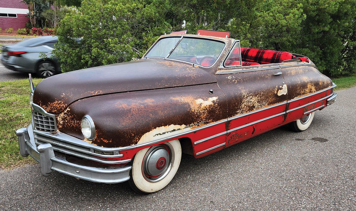 The Monte Carlo convertible as it appears today. Note the unique red-and-black upholstery and remnants of the unusual white-over-red paint scheme.